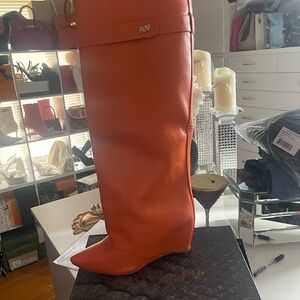 Azalea Wang Orange boots size 9. Good condition. See pics for minor scratches.